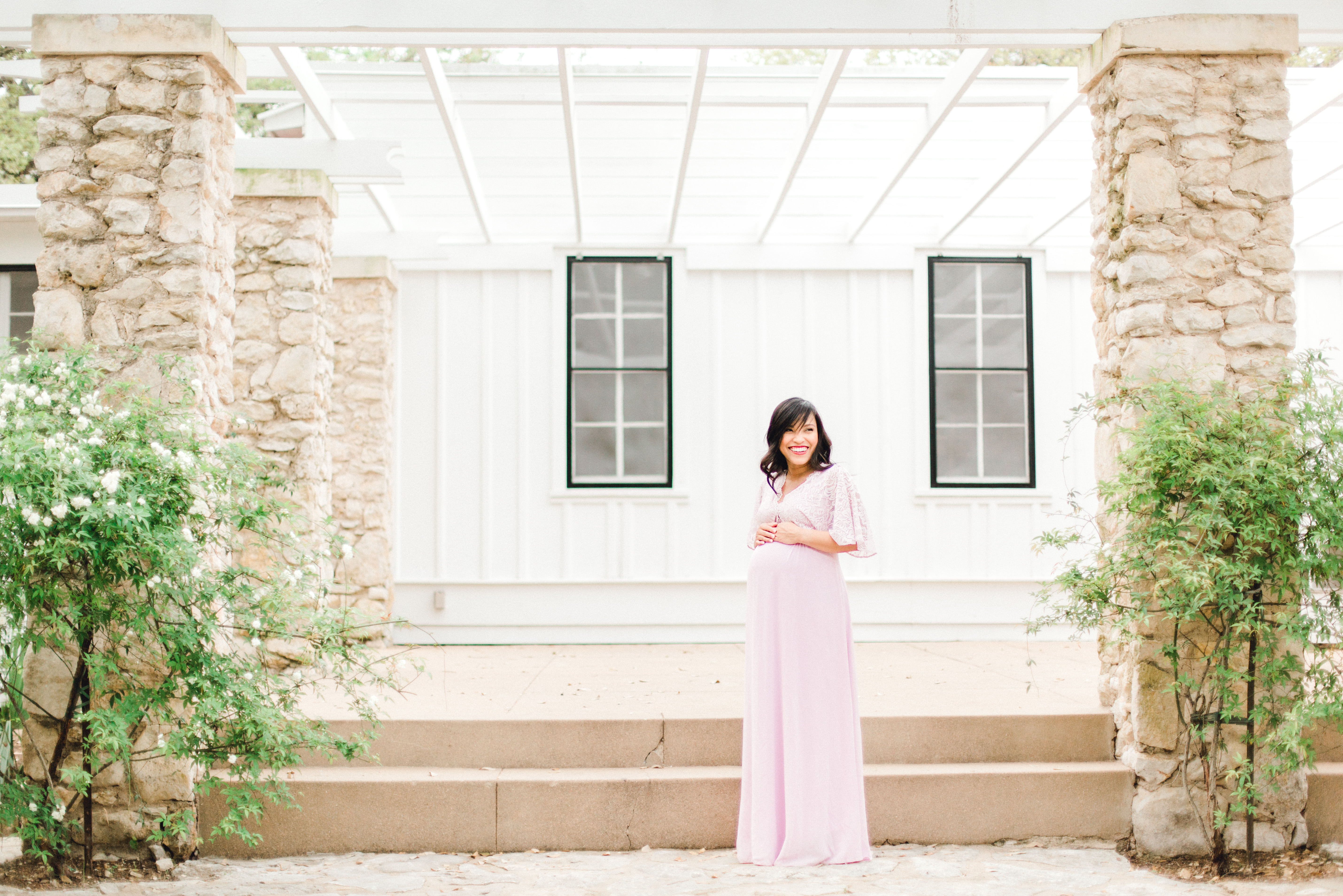 maternity session mother in pink dress in natural light 