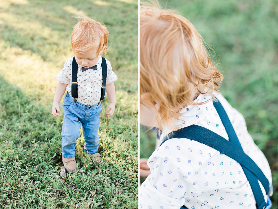 little boy walking in field. portrait session austin texas