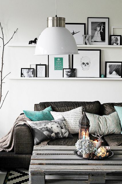 room view with shelves and framed artwork