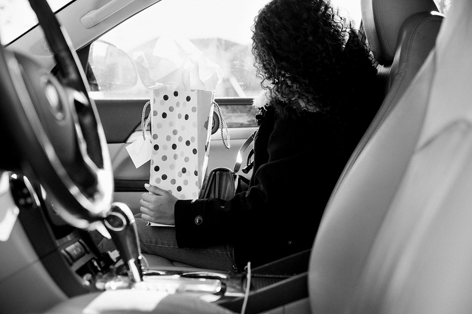 girl-in-car-with-gift-on-lap-austin-texas-photography