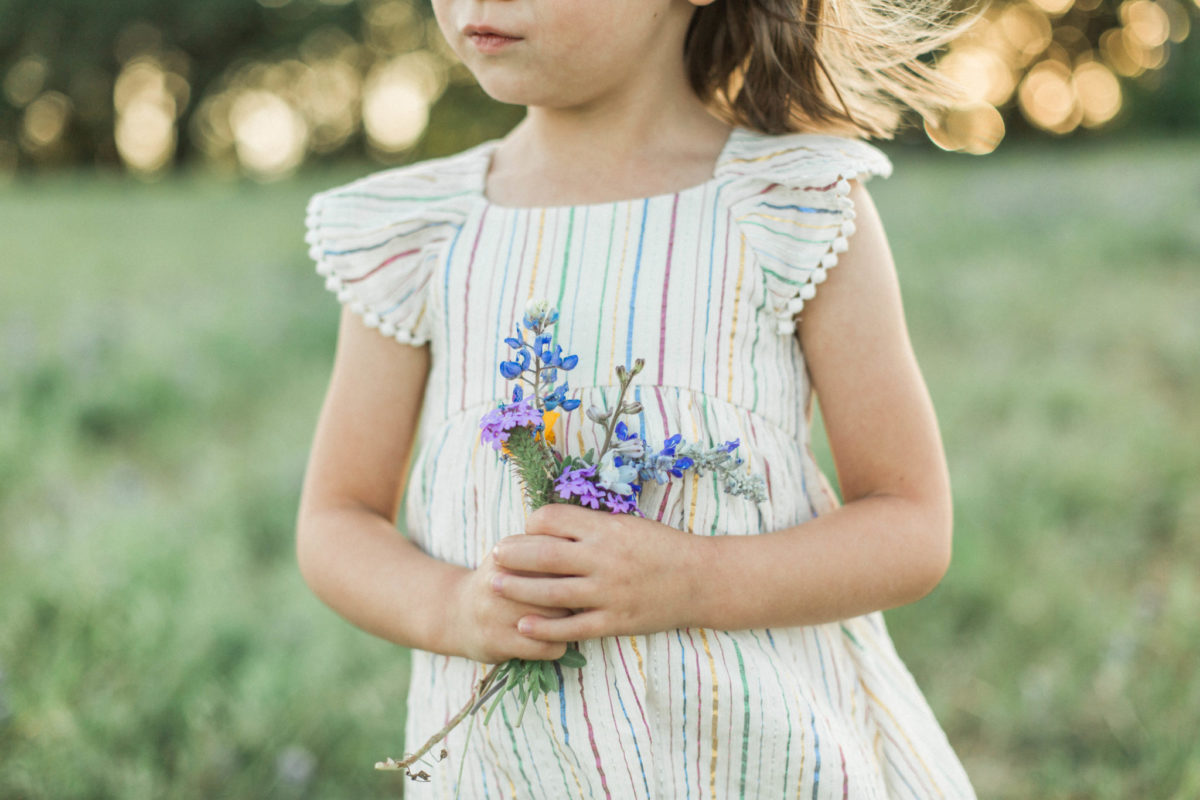 girl-holding-flowers-at-old-settlers-park-round-rock